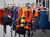 Photo of life jackets on hangers